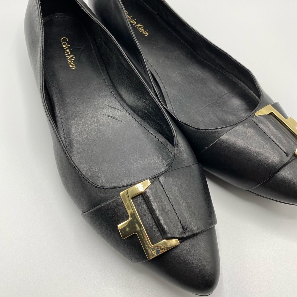 Calvin Klein black flats in 8 1/2